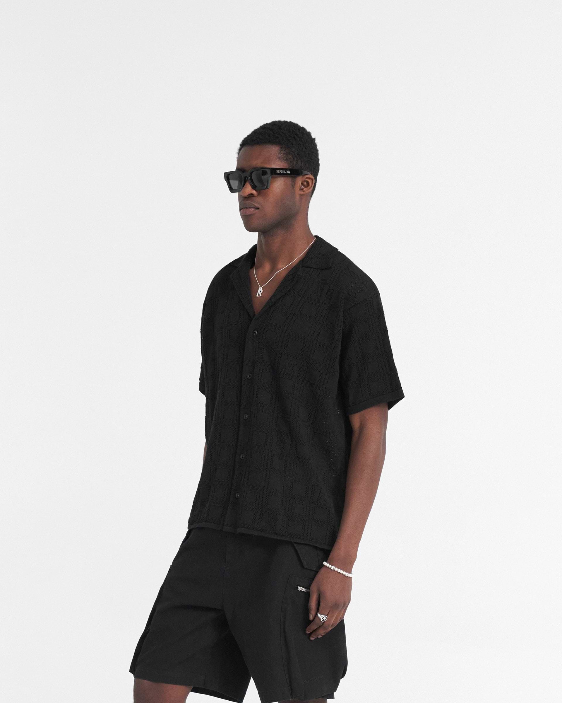 Back product image of a mens black shirt on a plain white background | Lace Knit Shirt in Black | Oversized shirt with crochet knit pattern | SS24 Shirts | Represent Clo