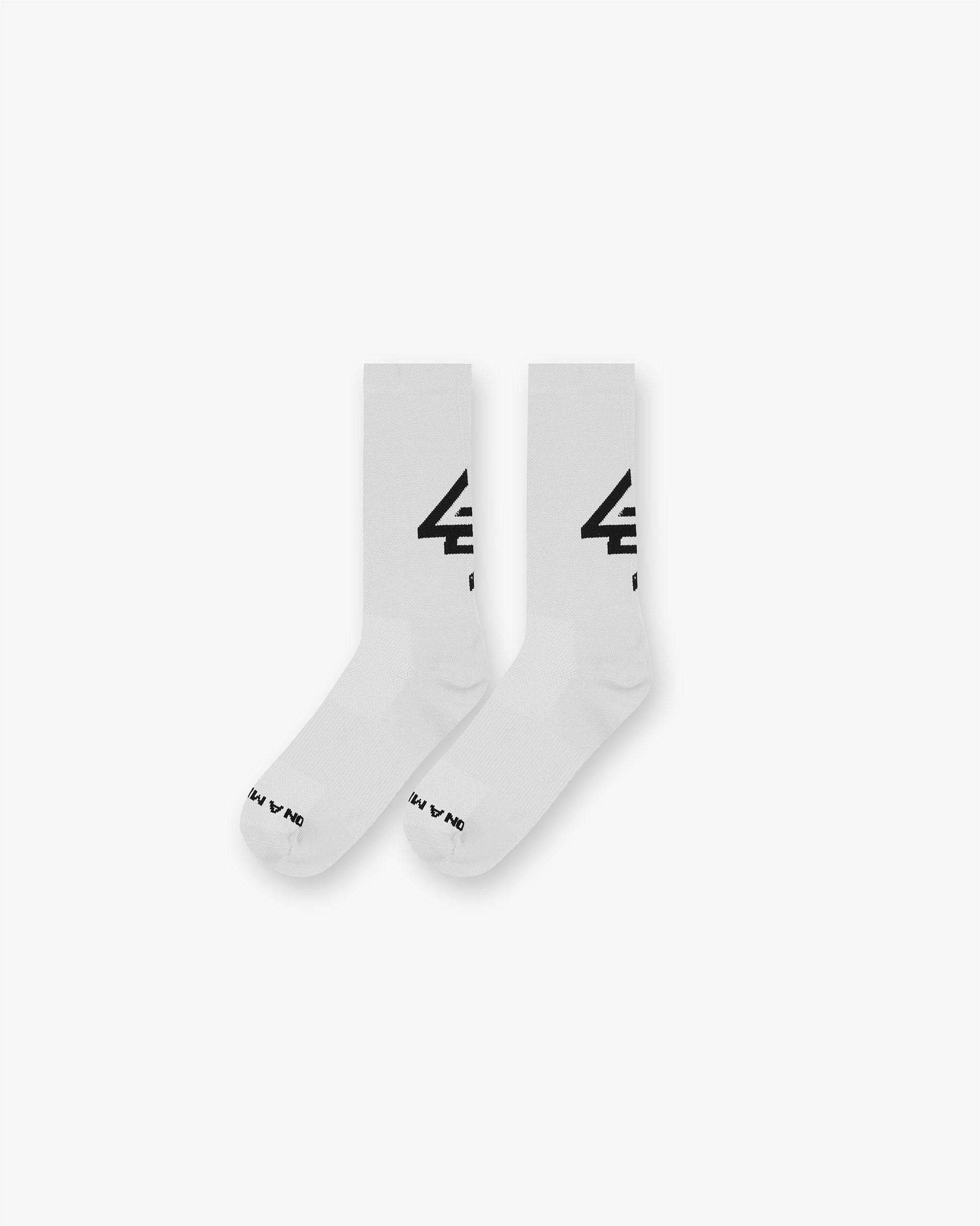 Back product image of a mens white sock with black logo on a plain white background | 247 Race Sock in White | Lightweight breathability and snug fit socks | 247 Accessories | Represent Clo