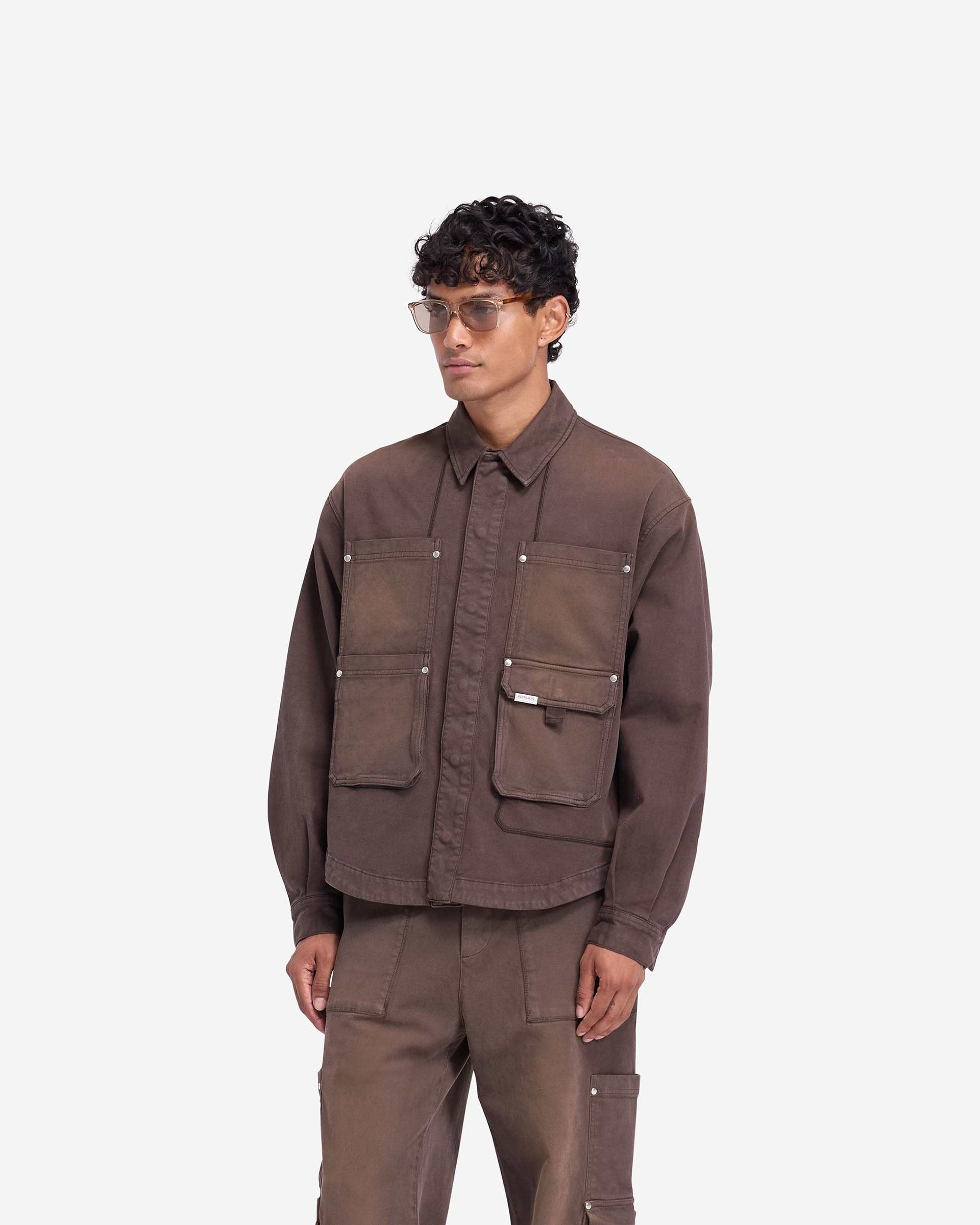 Back product image of a mens brown shirt on a plain white background | Workshop Shirt in Cedar | Shirt with back yoke and popper cuff adjusters | FW24 Shirts | Represent Clo