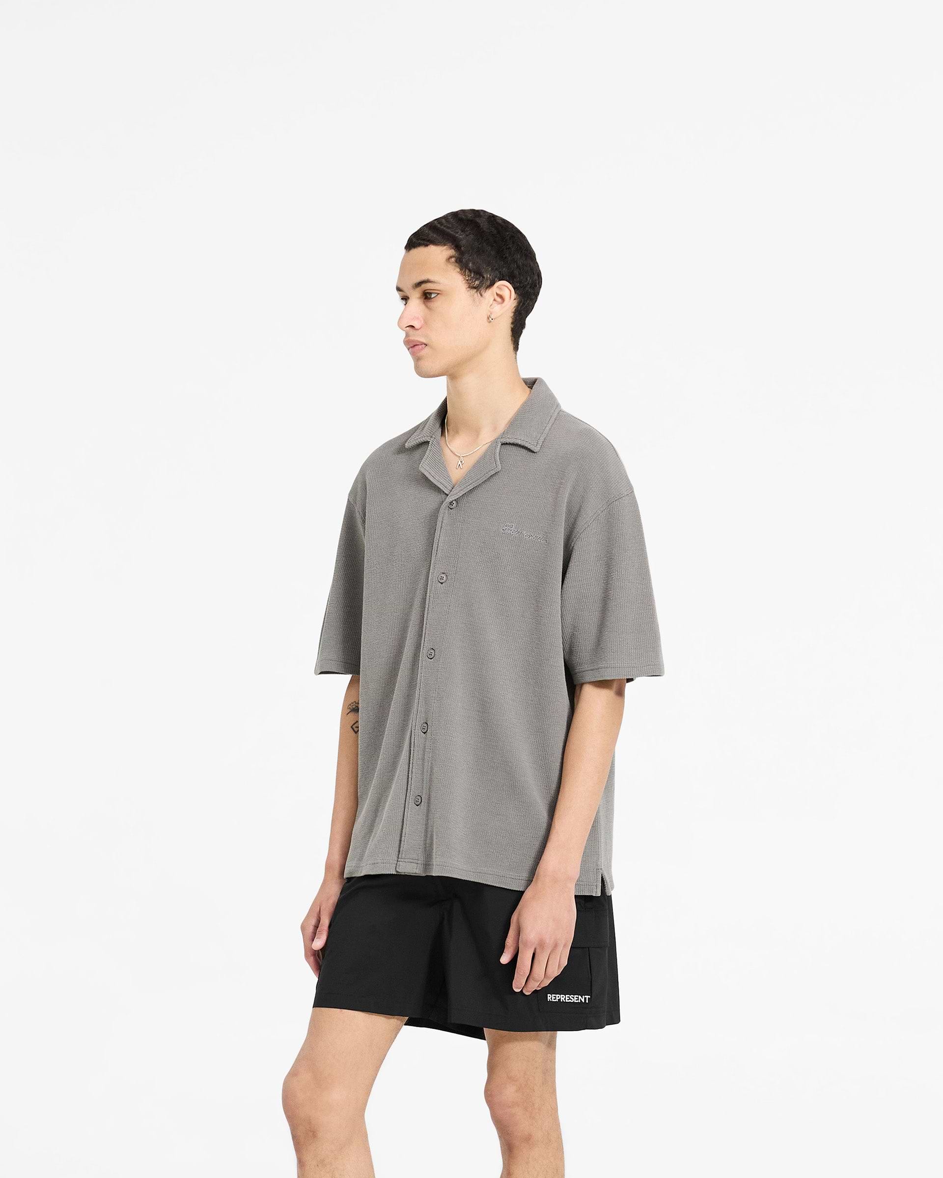 Back product image of a mens grey shirt on a plain white background | Waffle Shirt in Ultimate Grey | Drapey shirt with revere collar and side split hem | SC24 Shirts | Represent Clo