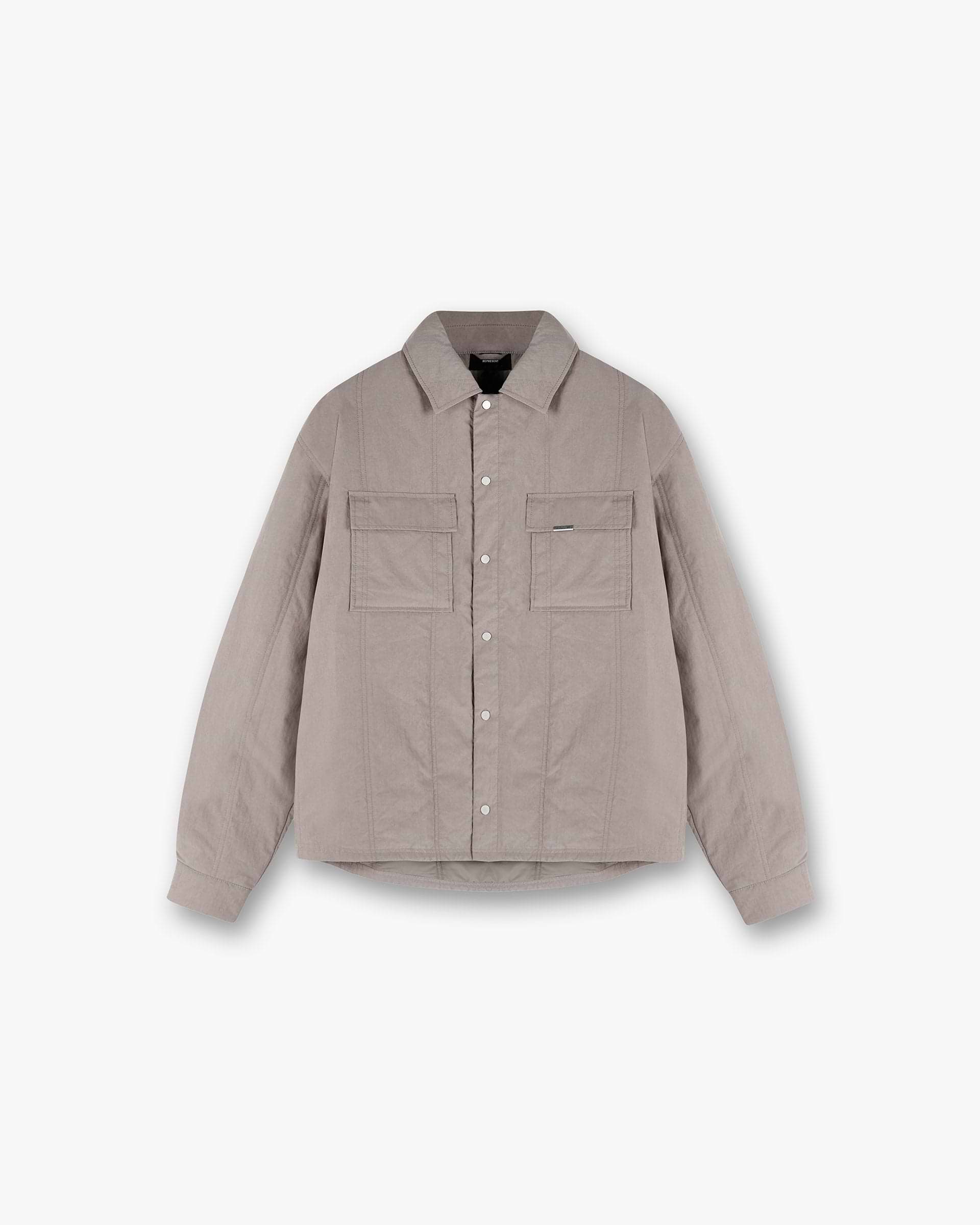 Front product image of a mens grey quilted overshirt on a plain white background | Quilted Overshirt in Mid Grey | Quilted shirt with a luxurious design | SS25 Shirts | Represent Clo