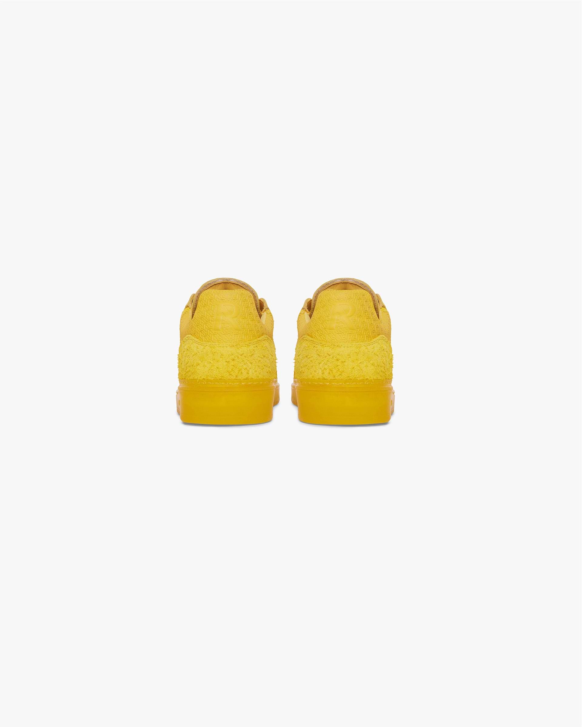 Low profile mens yellow sneakers on a plain white background | Virtus in Yellow | Sneakers with tri-leather and hairy suede upper | SS24 Footwear | Represent Clo