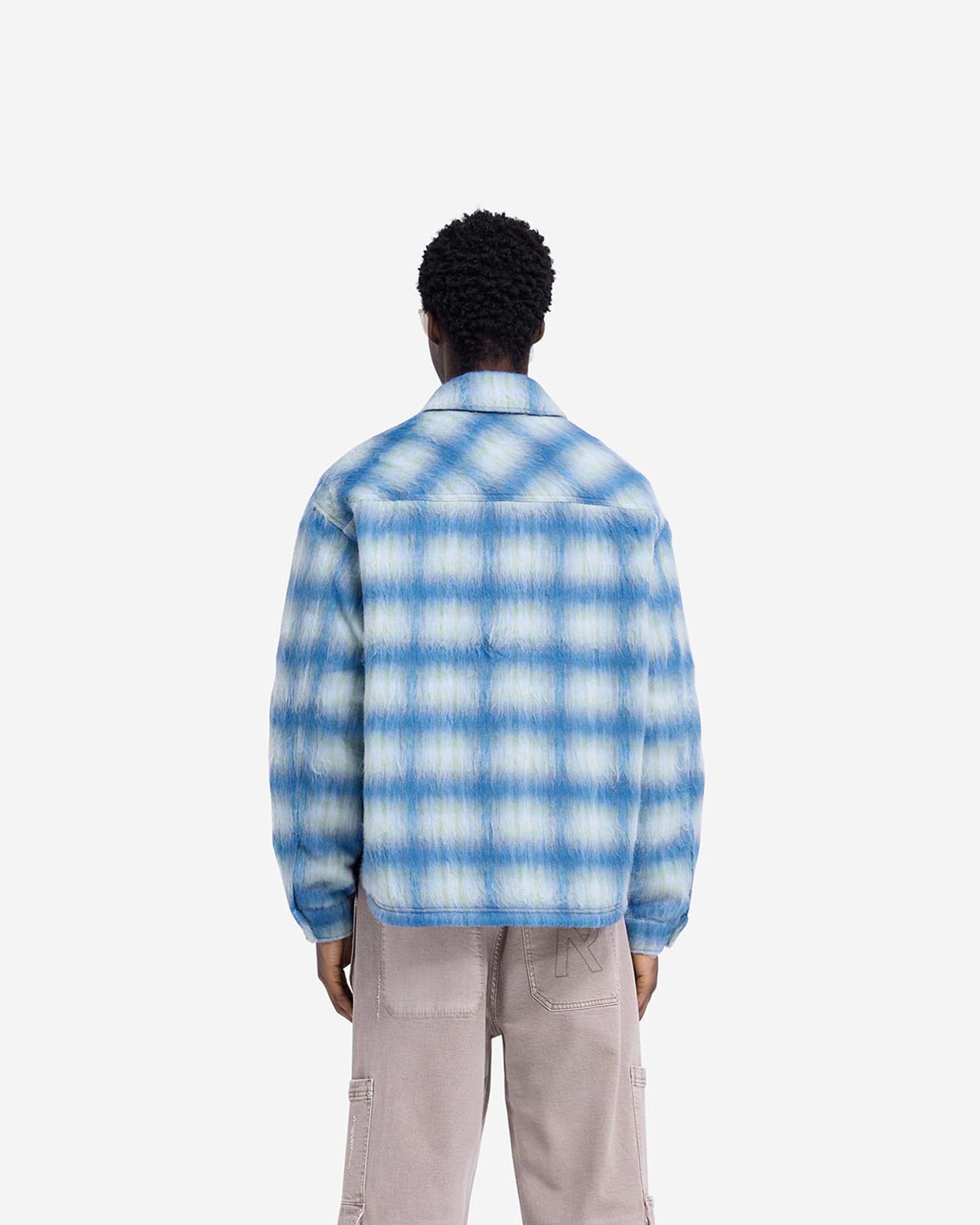 Man wearing an electric blue overshirt on a plain white background | Textured Overshirt in Electric Blue | Oversized fit with patch pockets | FW24 Shirts | Represent Clo
