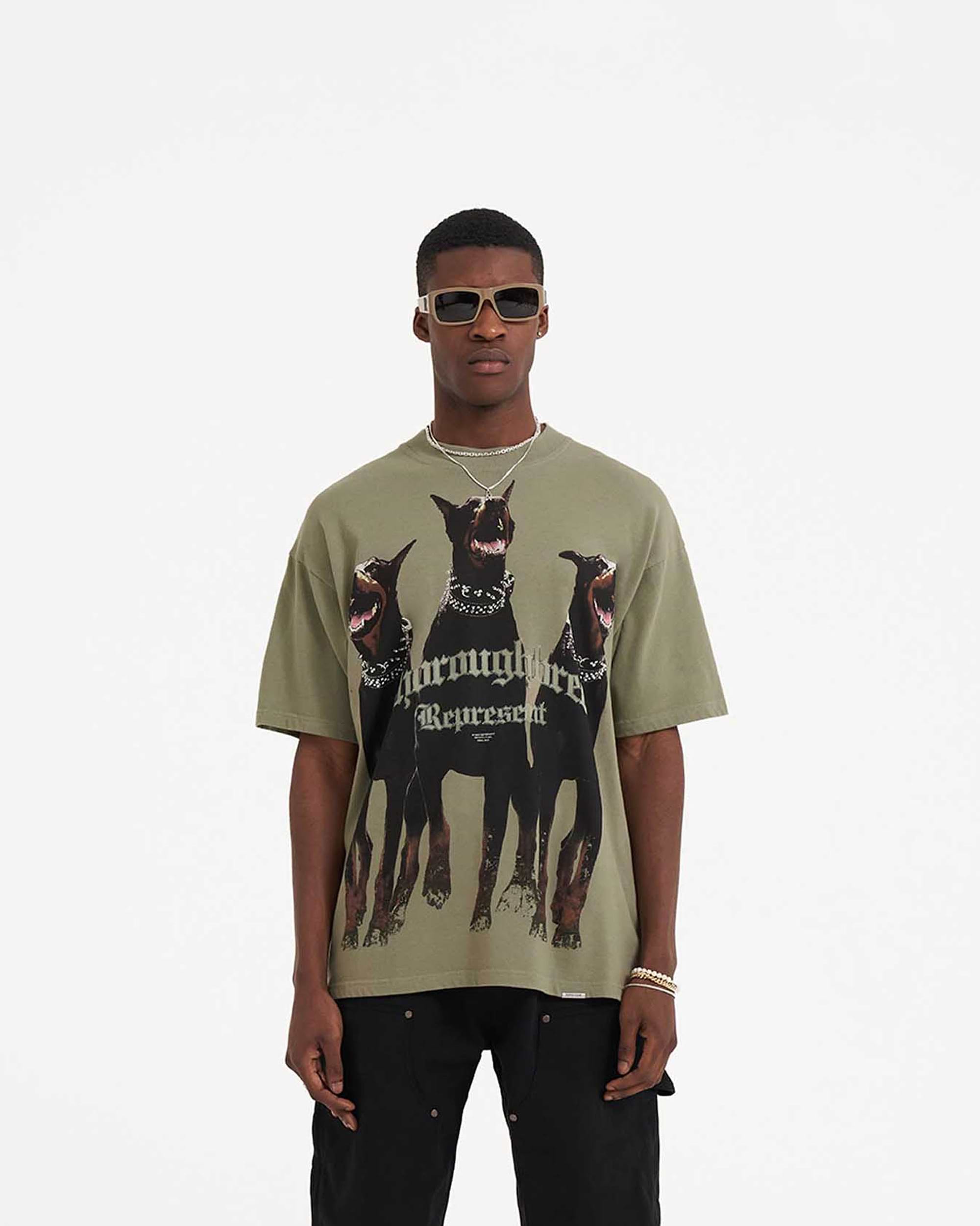 Back product image of a mens khaki t-shirt on a plain white background | Thoroughbred T-Shirt in Khaki | Short sleeve t-shirt with Thoroughbred graphic | SS23 T-Shirts | Represent Clo