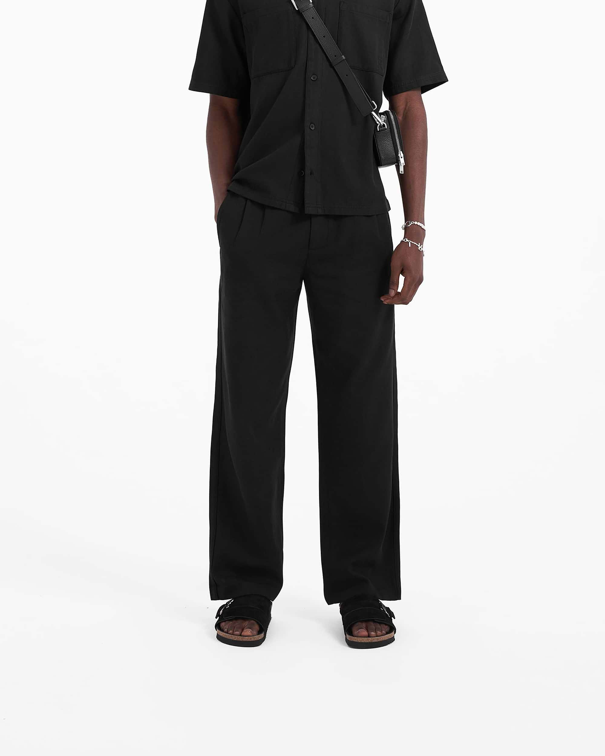 Back product image of mens black pants on a plain white background | Yacht Pant in Black | Relaxed fit pants with hybrid elasticated waistband | SC23 Pants | Represent Clo