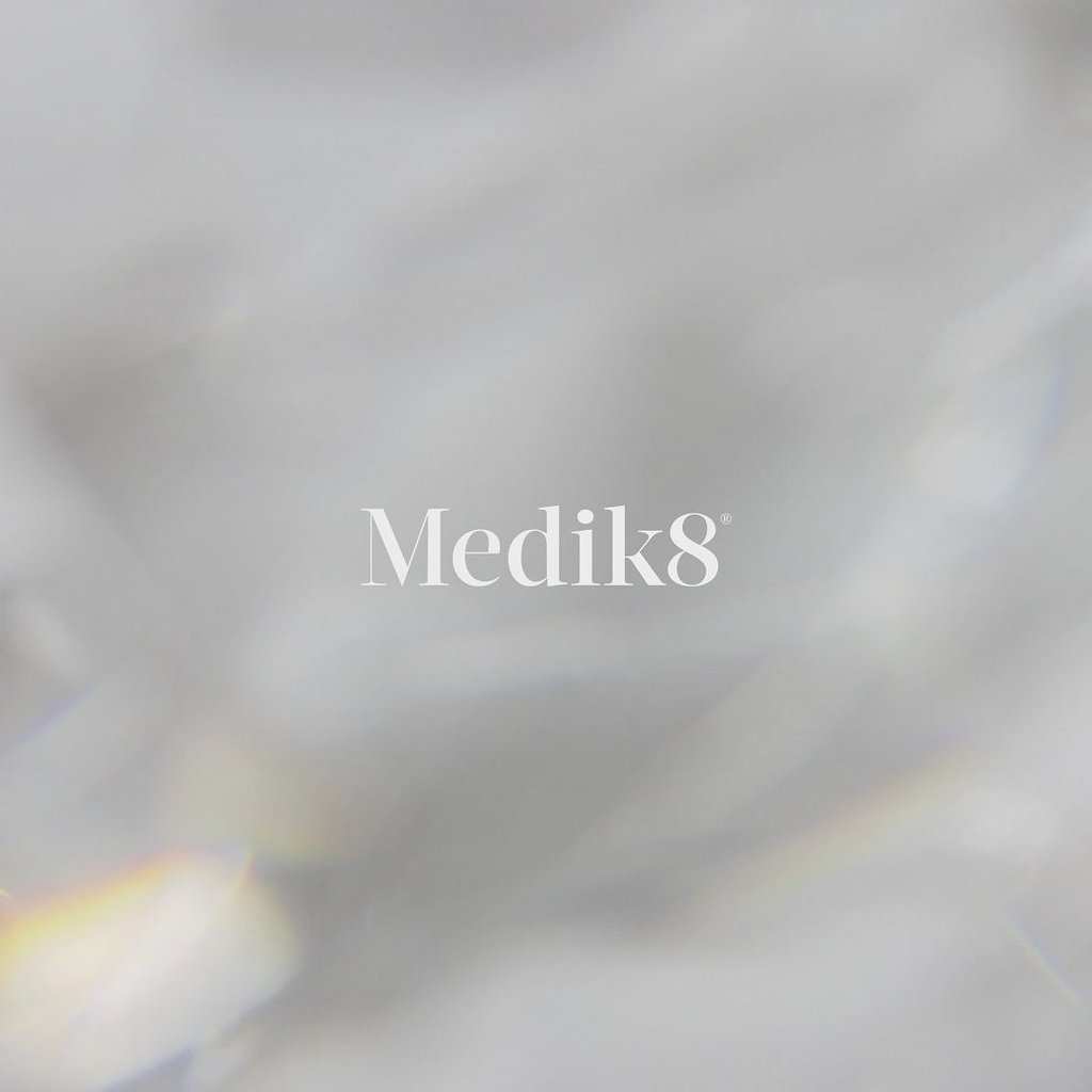 Promotional video for Medik8 Crystal Retinal Ceramide Eye cream showing individuals applying the product. Text highlights it improves the appearance of crow's feet, crepiness, dark circles, and puffiness. Claims note "100% saw a positive improvement" and "97% agree their eye area looks significantly more youthful". The video notes nourishing ceramides and availability in 3 clinical strengths.