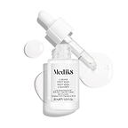Un frasco cuentagotas de vidrio transparente del sérum Liquid Peptides se presenta con el cuentagotas retirado y colocado al lado, junto a gotas de sérum que muestran la textura del producto.