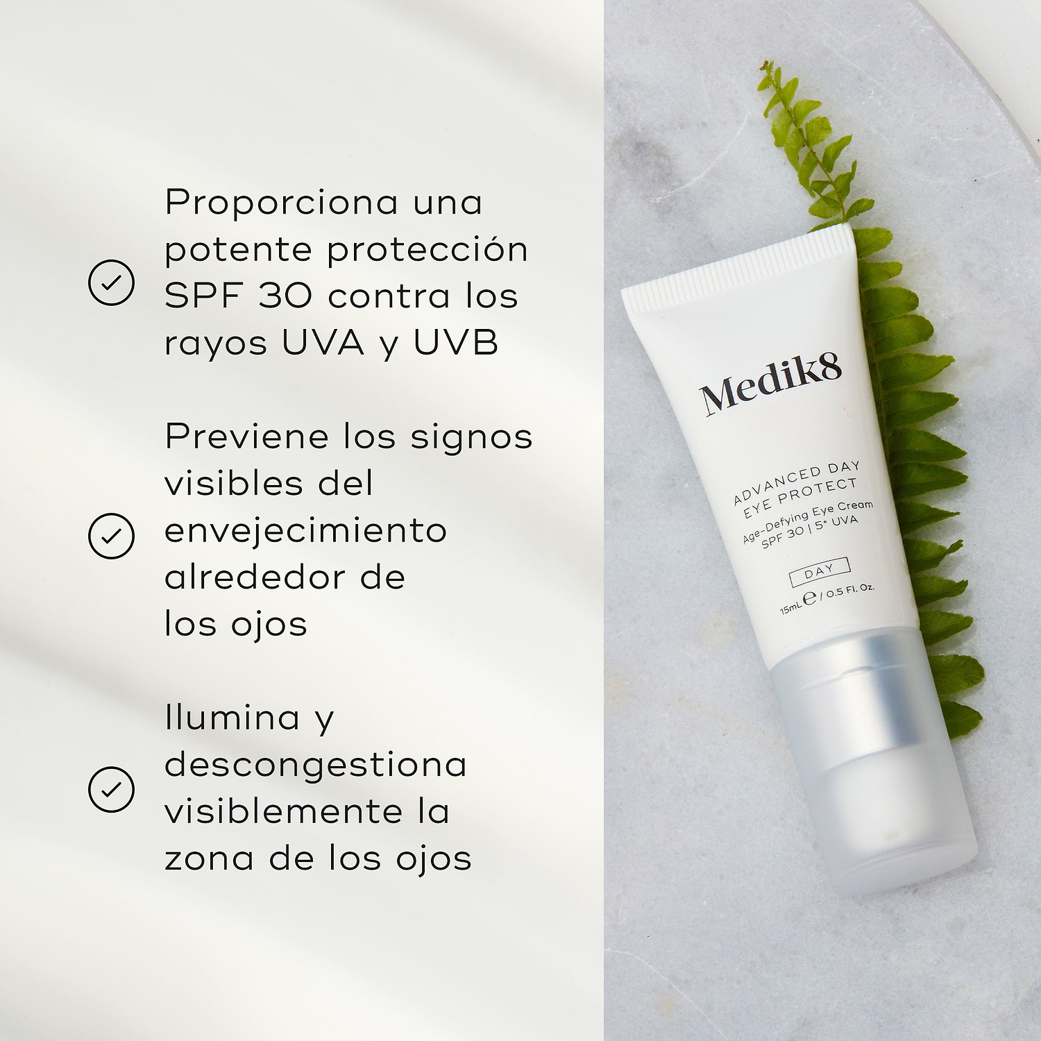 El tubo de Advanced Day Eye Protect yace sobre una superficie de mármol junto a una hoja verde de helecho. El texto destaca su protección SPF 30, la prevención de los signos visibles del envejecimiento y su capacidad para iluminar y desinflamar el contorno de ojos.
