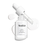 A clear glass dropper bottle of Liquid Peptides serum is presented, with its dropper removed and resting beside it and serum droplets, showing the texture