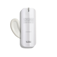 A sleek white pump bottle of r-Retinoate Day & Night stands upright, with a swirl of white cream next to it.