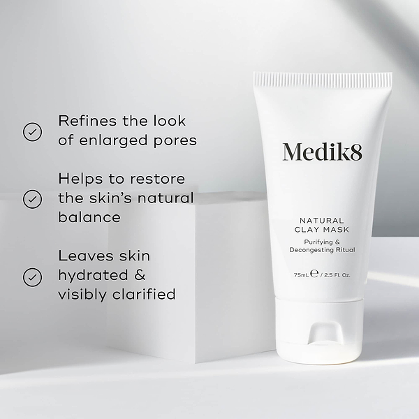 Natural Clay Mask is featured on a white geometric block. Three bullet points with checkmarks list benefits: Refines the look of enlarged pores, Helps to restore the skin's natural balance, and Leaves skin hydrated & visibly clarified.
