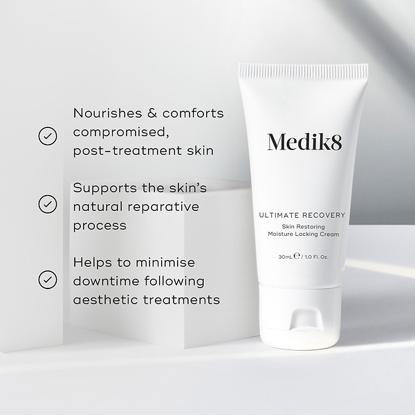 A white tube of Ultimate Recovery Skin Restoring Moisture Locking Cream is featured on a white geometric block. Three bullet points with checkmarks list benefits: Nourishes & comforts compromised, post-treatment skin, Supports the skin's natural reparative process, and Helps to minimise downtime following aesthetic treatments.