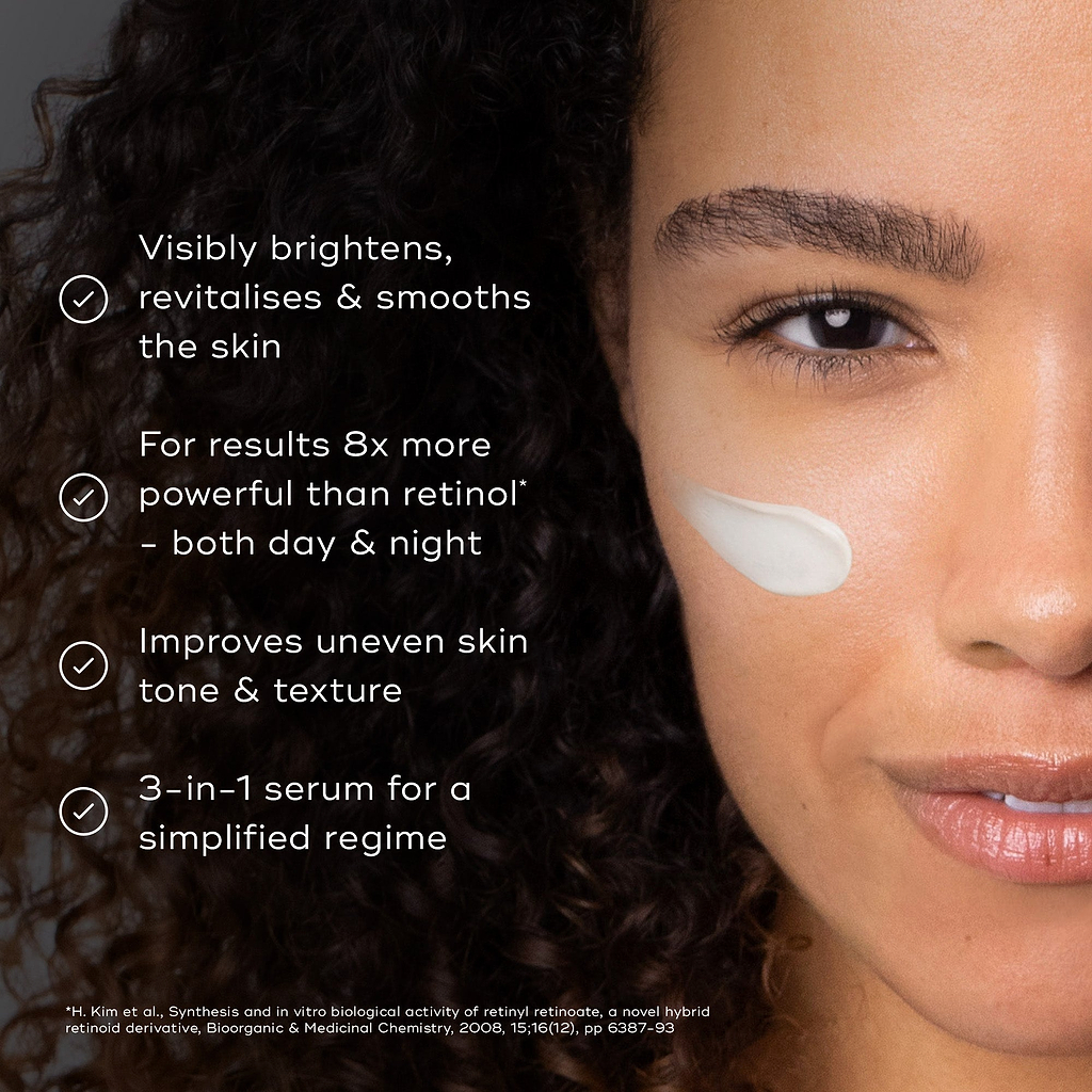 A woman's face is shown with a small amount of white cream on their cheek. Four bullet points with checkmarks list benefits: Visibly brightens, revitalises & smooths the skin; For results 8x more powerful than retinol* – both day & night; Improves uneven skin tone & texture; and a 3-in-1 serum for a simplified regime.