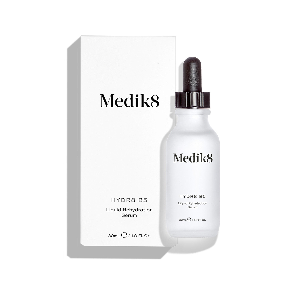 Medik8 Hydr8 B5 serum bottle stands in front of its matching white product carton on a clean white background. Text on both identifies the product as a 30mL "Liquid Rehydration Serum."
