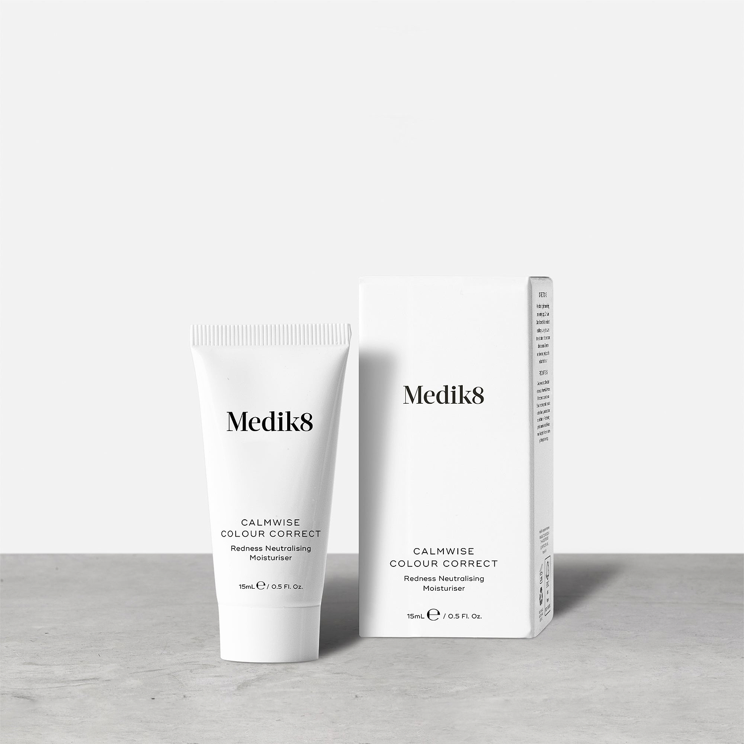 A small white tube of Calmwise Colour Correct (15mL) stands beside its white carton