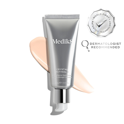A silver tube of Crystal Retinal 3 is displayed, with a pink swatch. A WORLD FIRST PATENTED TECHNOLOGY seal and a DERMATOLOGIST RECOMMENDED icon are shown. 
