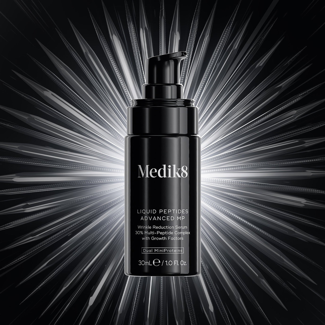 A Medik8 Liquid Peptides Advanced MP pump bottle centered against a striking black background with bright, radiating 3D starburst light rays. Text on the dark bottle describes it as a 