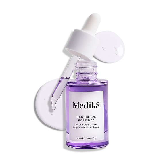 A purple glass dropper bottle of Bakuchiol Peptides serum, with its dropper removed. A swirl of the purple serum is shown, emphasising the product's texture.-68