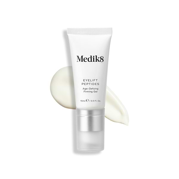 A tube of Eyelift Peptides stands upright, with a swatch of the product behind it.