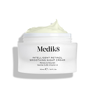 A shot of the Intelligent Retinol Smoothing Night Cream jar, open and showing the cream, on a white background. 