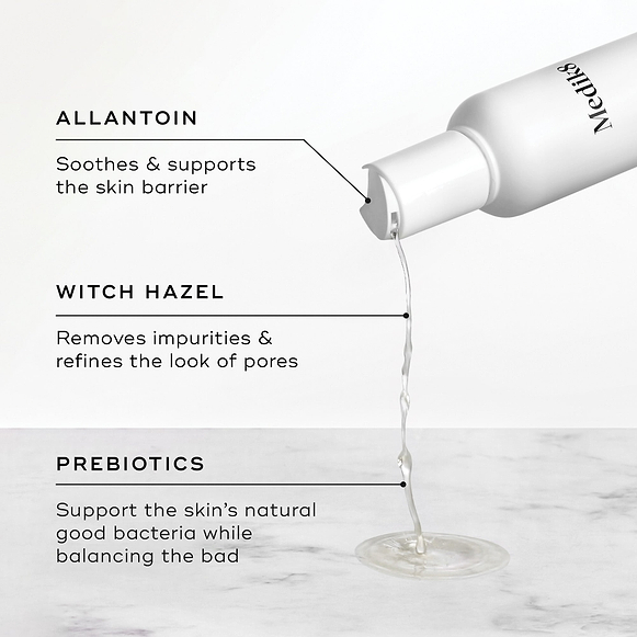 Liquid pours from the Daily Refresh Balancing Toner bottle. Text highlights Allantoin to soothe, Witch Hazel to refine pores, and Prebiotics to balance skin bacteria.-hover-47