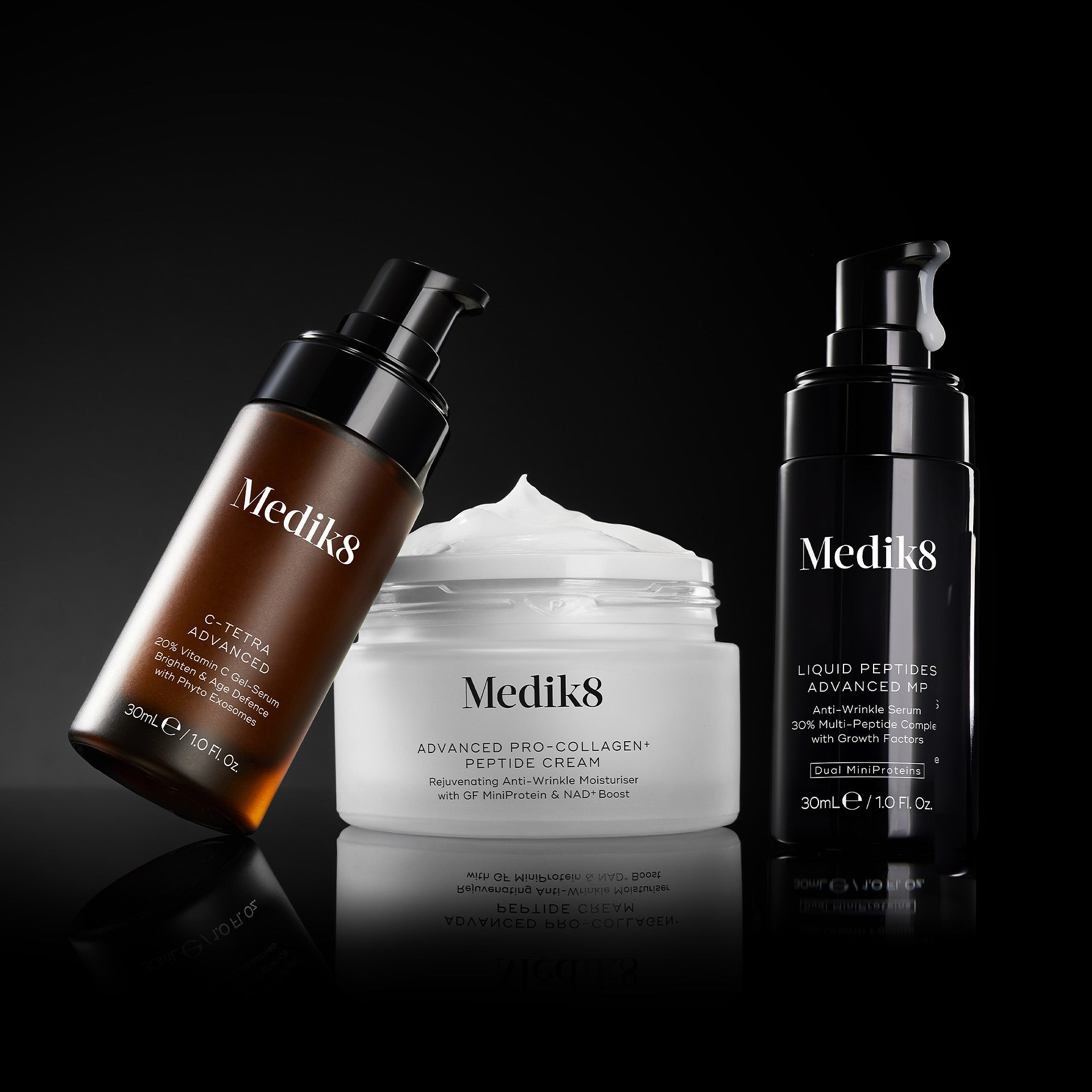 3 products on black backgrounf leaning on eachother. The products are C-Tetra Advanced, Advanced Pro-Collagen Peptide Cream and Liquid Peptides Advanced MP