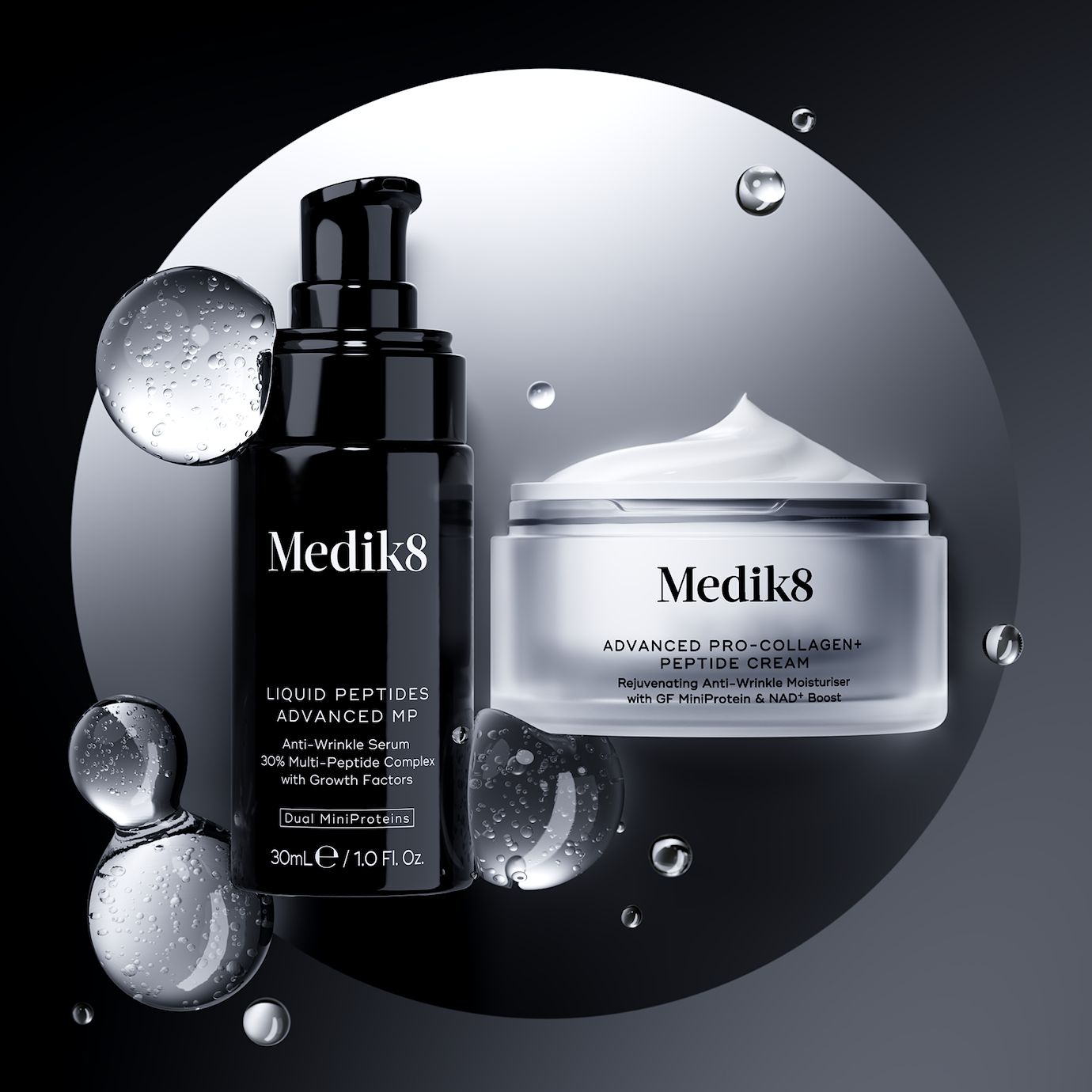 A duo of Medik8 peptide products displayed on a silver circular background with water droplets. On the left is the Liquid Peptides Advanced MP serum bottle, and on the right is an open jar of Advanced Pro-Collagen+ Peptide Cream.