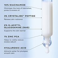 Skincare serum dropper with ingredient labels on a light blue background