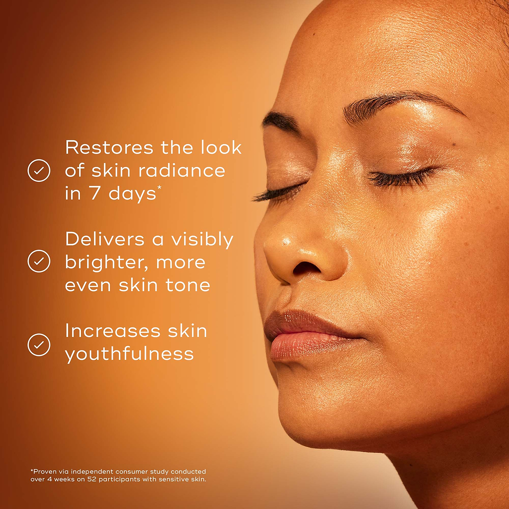 Close-up profile of a model with glowing skin and closed eyes against a warm gradient background. Text highlights proven, effective & stabilised Vitamin C, maximum results with minimal irritation, and textures to suit every skin type.