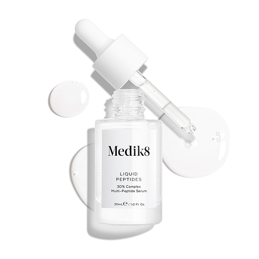 Flacone trasparente in vetro di siero Liquid Peptides presentato con la pipetta rimossa e appoggiata accanto, con gocce di siero visibili a mostrare la consistenza.