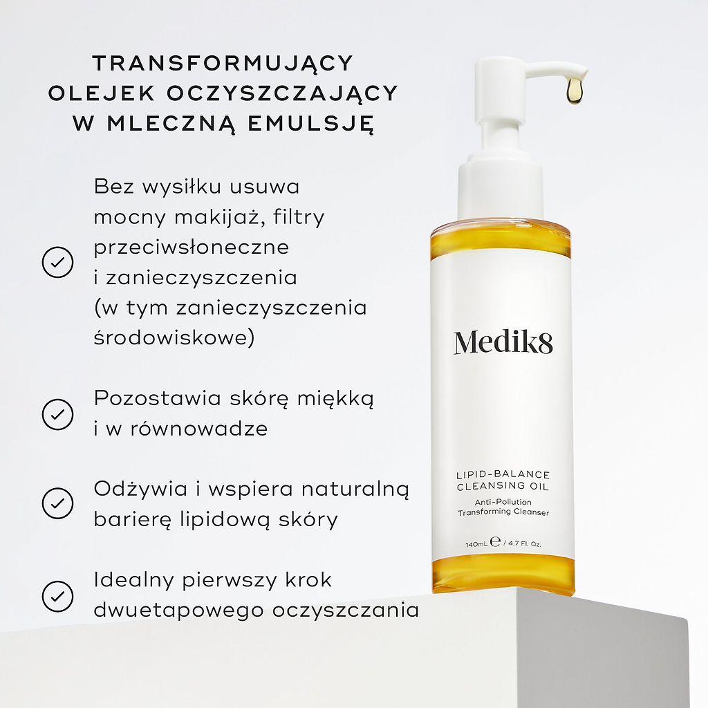 Butelka olejku oczyszczającego Lipid-Balance stoi na białym podkładce. W opisie wymieniono zalety produktu, w tym usuwanie intensywnego makijażu, wzmacnianie bariery lipidowej oraz działanie jako olejek do demakijażu, który zmienia konsystencję w mleczko.
