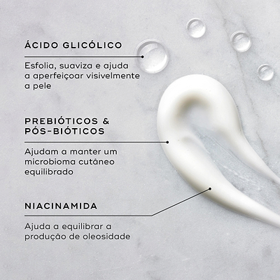 Close-up de um creme branco e gotas de líquido transparente num fundo de mármore claro. Linhas de texto destacam os ingredientes-chave: Ácido Glicólico para esfoliar, suavizar e ajudar a aperfeiçoar visivelmente a pele; Prebióticos e Pós-bióticos para ajudar a manter um microbioma cutâneo equilibrado; e Niacinamida para ajudar a equilibrar a produção de oleosidade.
