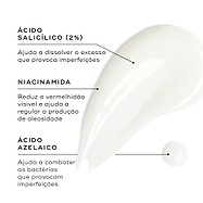 Close-up de uma amostra de gel transparente contra um fundo branco. Linhas de texto destacam os ingredientes-chave: Ácido Salicílico (2%) para ajudar a dissolver o excesso que provoca imperfeições, Niacinamida para reduzir a vermelhidão visível e ajudar a regular a produção de oleosidade, e Ácido Azelaico para ajudar a combater as bactérias que provocam imperfeições.
