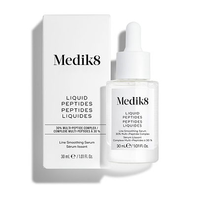 Frasco de vidro transparente com conta-gotas do sérum Liquid Peptides colocado à frente da sua embalagem de cartão branca.