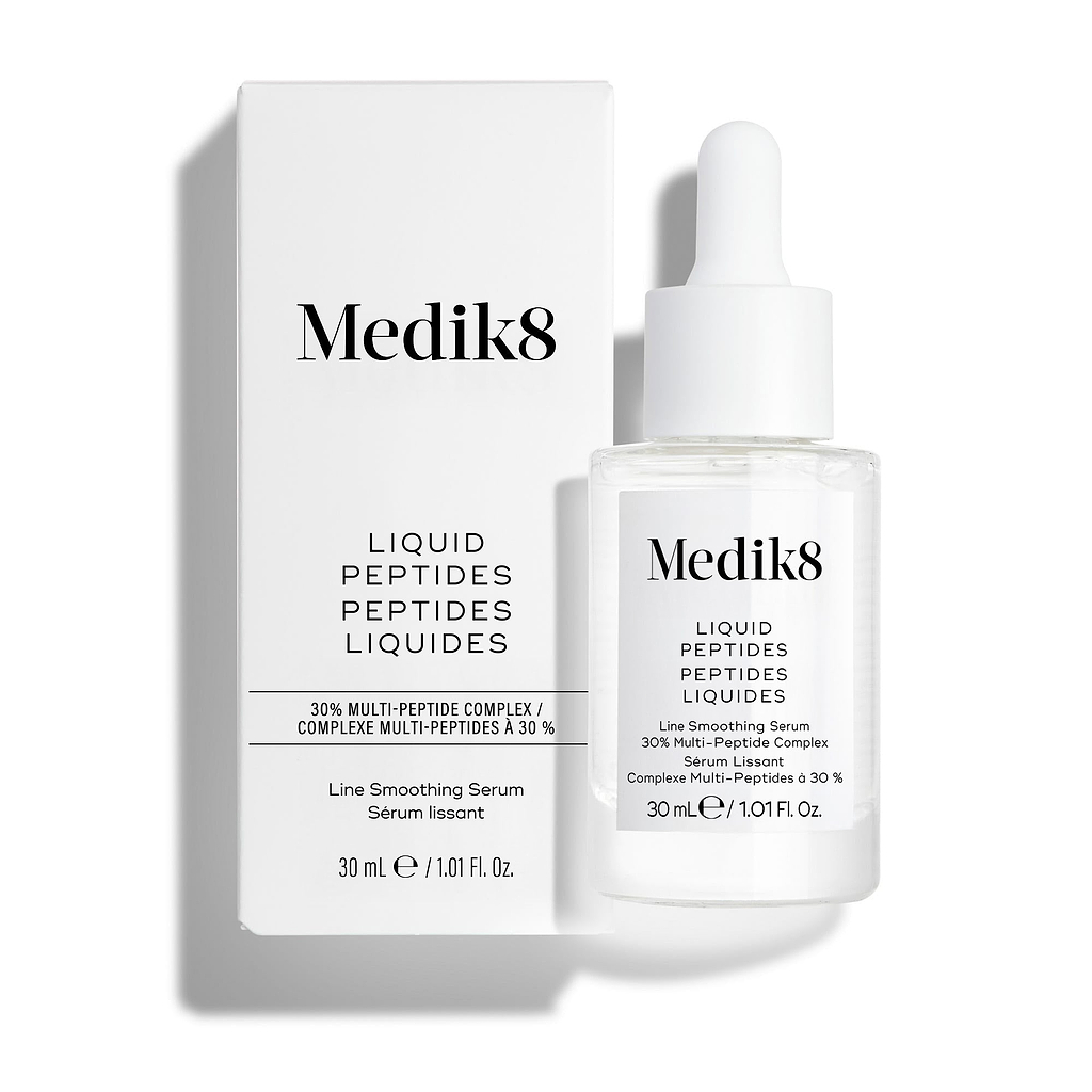 Frasco de vidro transparente com conta-gotas do sérum Liquid Peptides colocado à frente da sua embalagem de cartão branca.