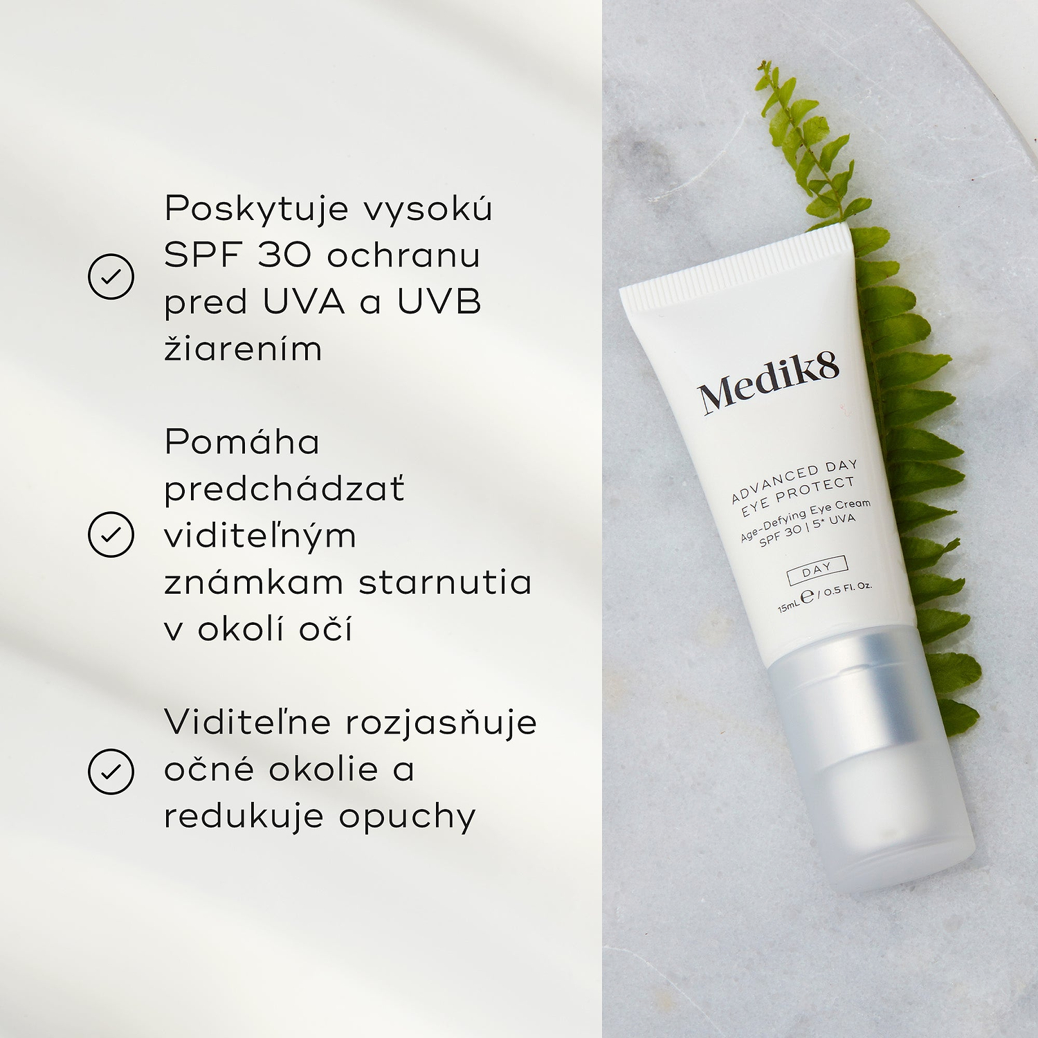 Tuba krému Advanced Day Eye Protect leží na mramorovom povrchu vedľa zeleného listu paprade. Text zdôrazňuje ochranu SPF 30, prevenciu viditeľných známok starnutia a schopnosť rozjasniť očné okolie a zmierniť opuchy.
