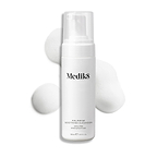 Medik8 Calmwise Soothing Cleanser pump bottle displayed on a white background with a smear of white foam behind it, highlighting the product's texture.