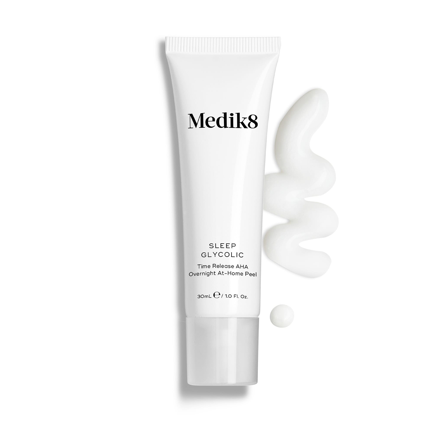 Medik8 Sleep Glycolic tube stands against a clean white background with a wavy swipe and a small droplet of white cream texture. Text identifies the product as a Time Release AHA Overnight At-Home Peel in a 30mL size.