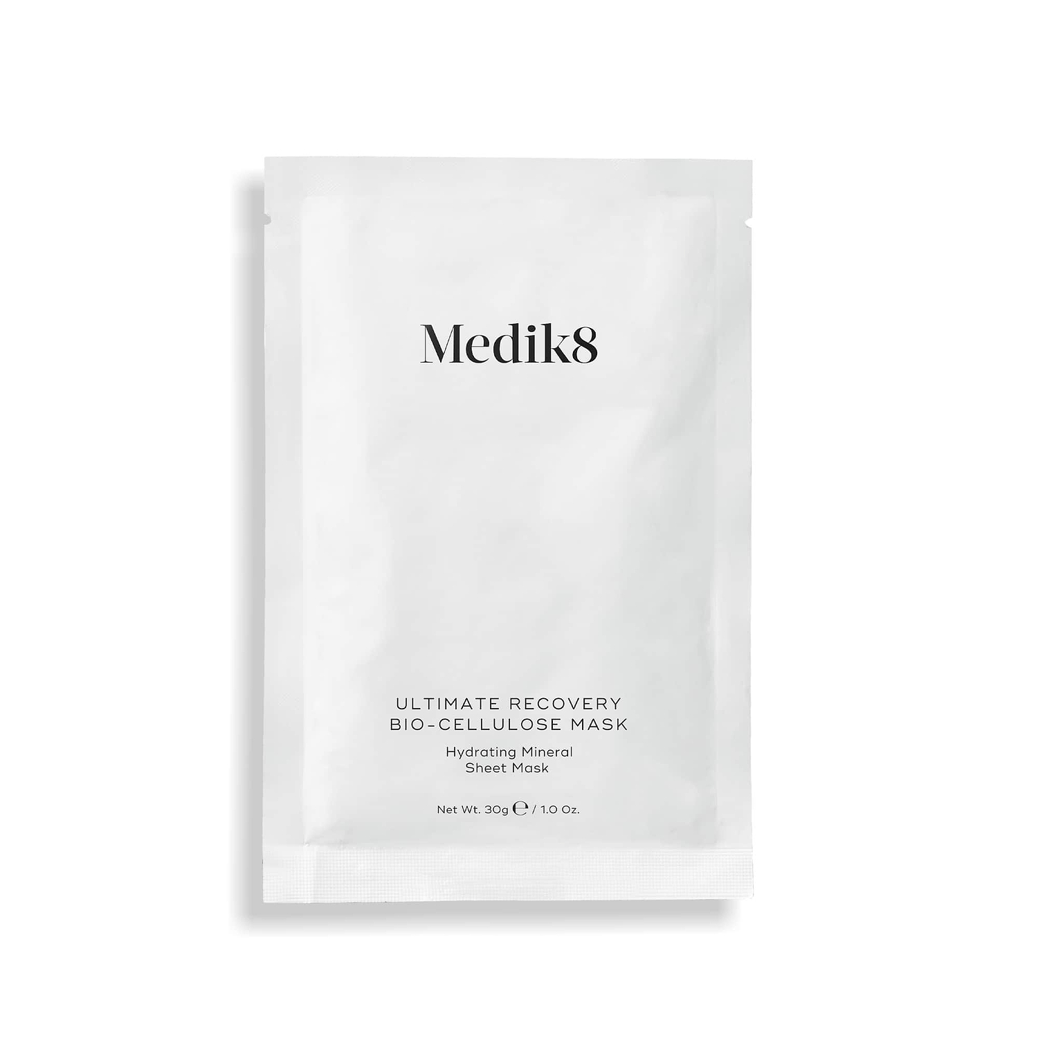 A single white sachet of Medik8 Ultimate Recovery Bio-Cellulose Mask displayed flat against a clean white background with a subtle shadow. Text labels it as a "Hydrating Mineral Sheet Mask."
