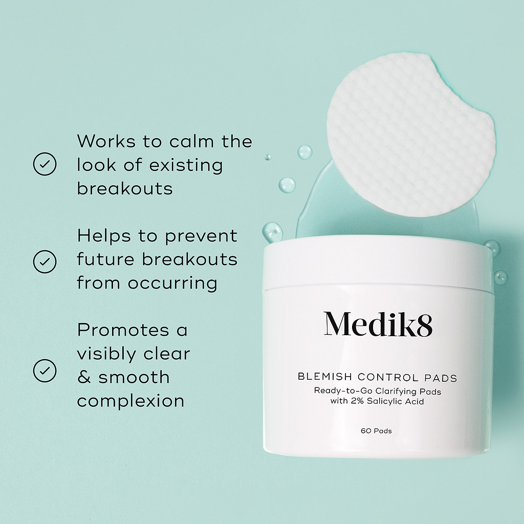 Medik8 Blemish Control Pads jar is shown against a light teal background with a single textured white pad and clear liquid droplets. Text highlights that the product "Works to calm the look of existing breakouts," "Helps to prevent future breakouts from occurring," and "Promotes a visibly clear & smooth complexion."