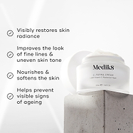 Medik8 C-Tetra Cream jar displayed on a grey stone block against a white background with soft light rays. The image features four check-marked claims: Visibly restores skin radiance, Improves the look of fine lines & uneven skin tone, Nourishes & softens the skin and Helps prevent visible signs of ageing