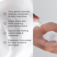 A split image featuring the foam texture alongside a list of benefits, including "Very gently removes makeup, sunscreen & daily impurities" and "Especially formulated for very sensitive skin types."