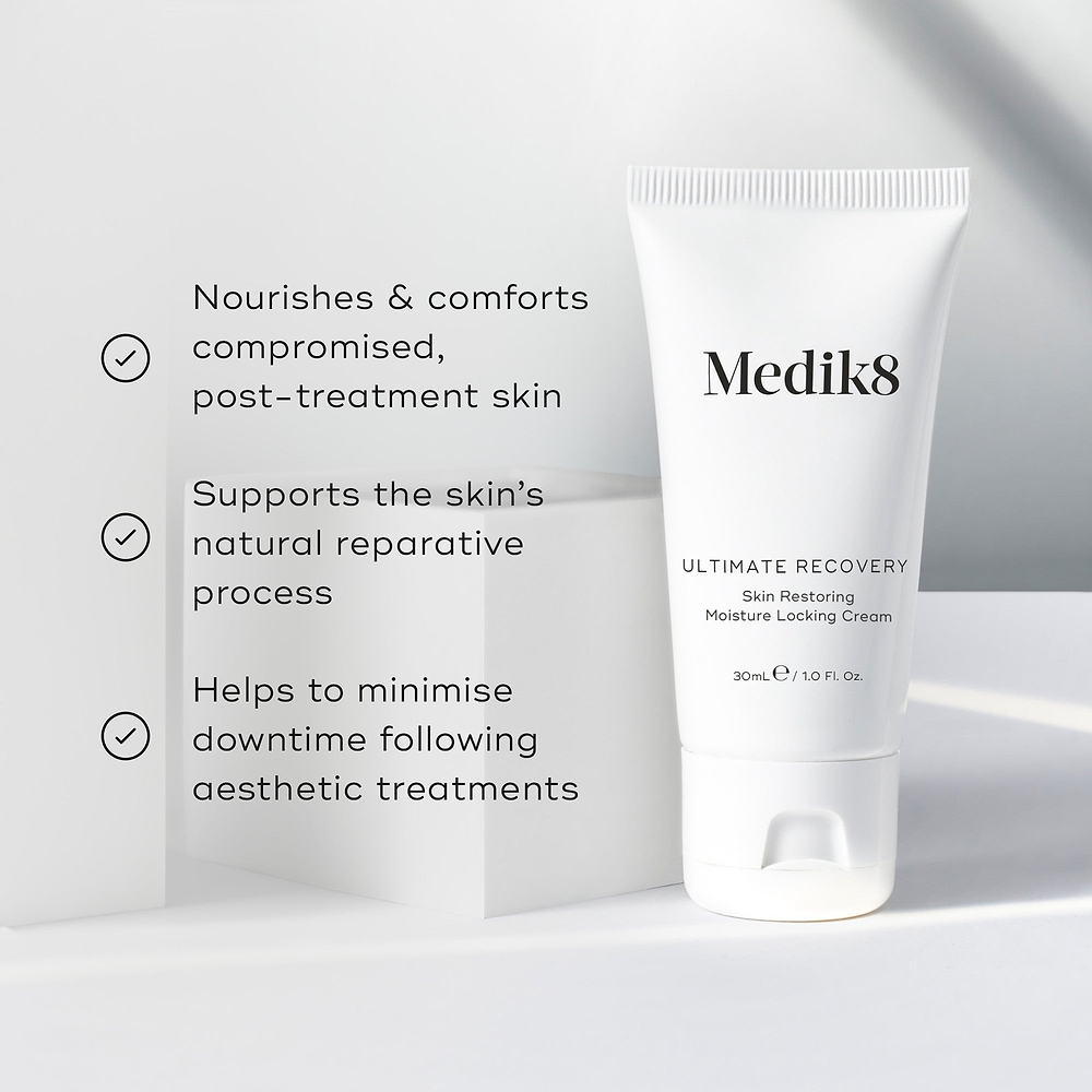 Medik8 Ultimate Recovery Skin Restoring Moisture Locking Cream tube sits against a clean white architectural background. Text claims the product nourishes compromised post-treatment skin, supports the natural reparative process, and minimizes downtime following aesthetic treatments.