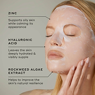 Close-up of a person wearing a translucent white sheet mask on their face against a light grey background. Text points to key ingredients: ZINC (Supports oily skin while calming its appearance), HYALURONIC ACID (Leaves the skin deeply hydrated & visibly supple), and ROCKWEED ALGAE EXTRACT (Helps to improve the skin's natural resilience).