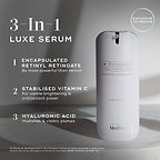 A large white cylindrical airless pump dispenser bottle of Medik8 r-Retinoate® Day & Night stands vertically against a light grey minimalist background with subtle shadows. Text overlays on the left highlight its key features as a "3-In-1 LUXE SERUM":

"ENCAPSULATED RETINYL RETINOATE 8x more powerful than retinol*"

"STABILISED VITAMIN C For visible brightening & antioxidant power"

"HYALURONIC ACID Hydrates & visibly plumps"
A circular badge at the top right indicates "EXCLUSIVE TO Medik8". 