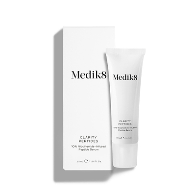 Medik8 Clarity Peptides tube stands next to its white packaging carton on a white background. Text identifies it as a "10% Niacinamide-Infused Peptide Serum" in a 30mL size.