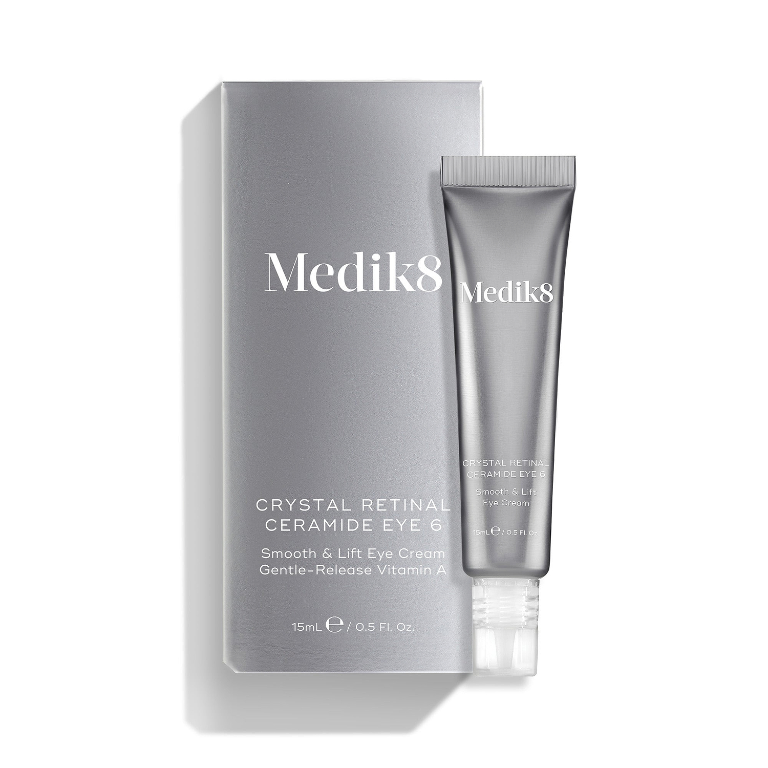 A silver tube of Crystal Retinal Ceramide Eye 6 is shown standing beside its matching silver carton.
