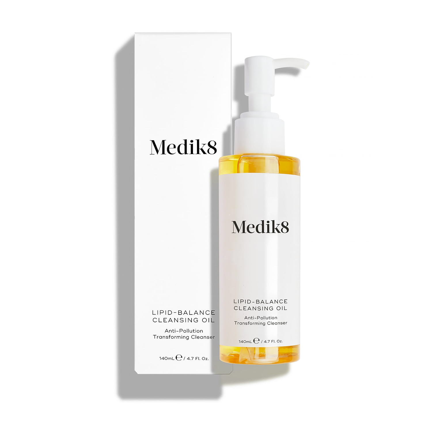 Medik8 Lipid-Balance Cleansing Oil bottle stands next to its white packaging carton. Text highlights the "Anti-Pollution Transforming Cleanser" formula and 140mL size.