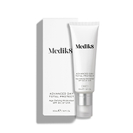 Medik8 Advanced Day Total Protect tube stands on a clean white background with a matching white outer carton. Text identifies the product as a 50mL Age-Defying Moisturiser with SPF 30 and 5* UVA protection.