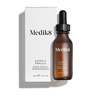 Medik8 Super C Ferulic serum bottle and its white cardboard carton displayed on a clean white background with soft shadows. The amber glass bottle with a black dropper cap and the matching white box both feature the Medik8 logo and identify the product as "SUPER C FERULIC Potent Vitamin C Brightening Serum" in a 30mL size.